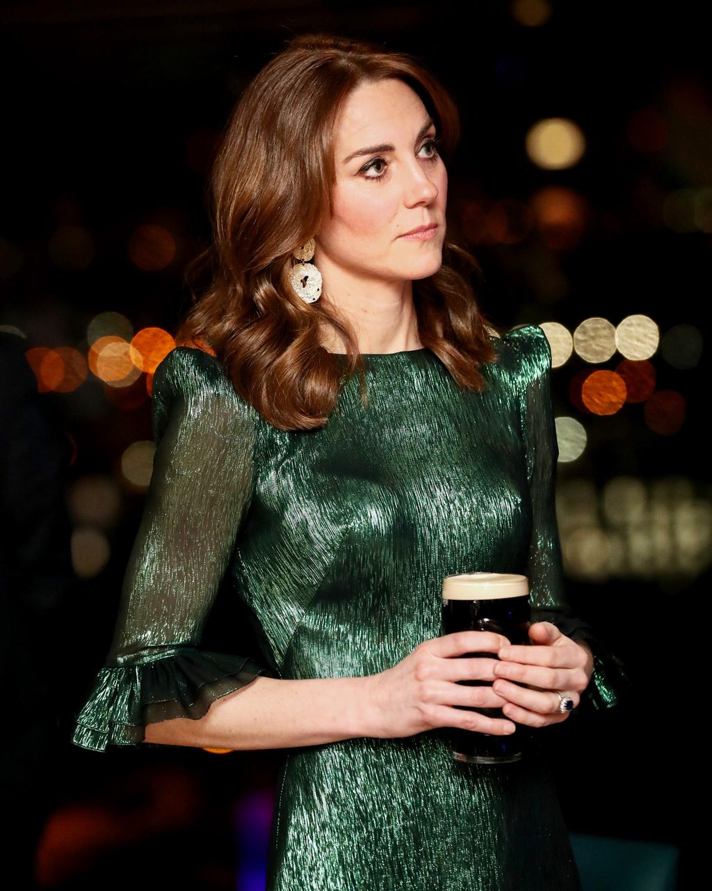 catherine-duchess-of-cambridge-holds-a-pint-of-guinness-as-news-photo-1583339464